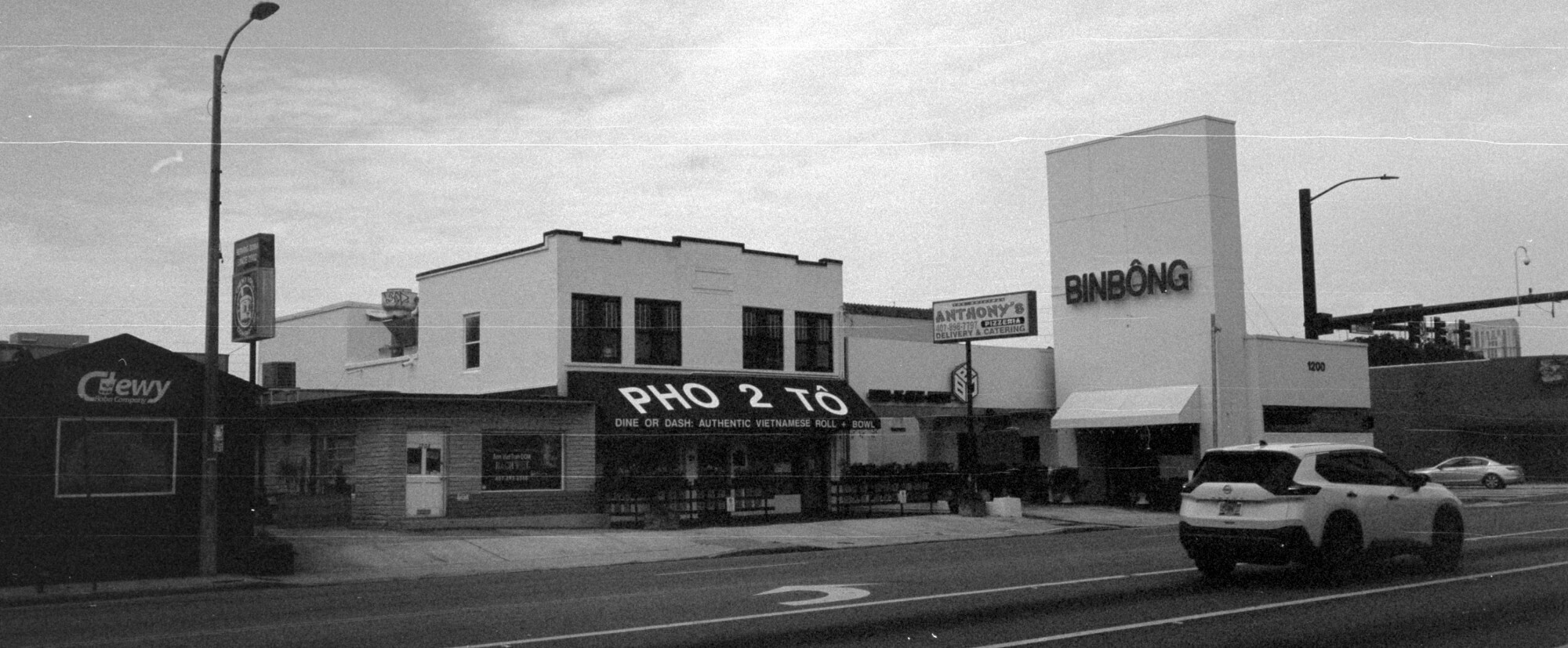 Panorama of the intersection of Mills and SR50, showing Chewy Boba, Pho 2 To