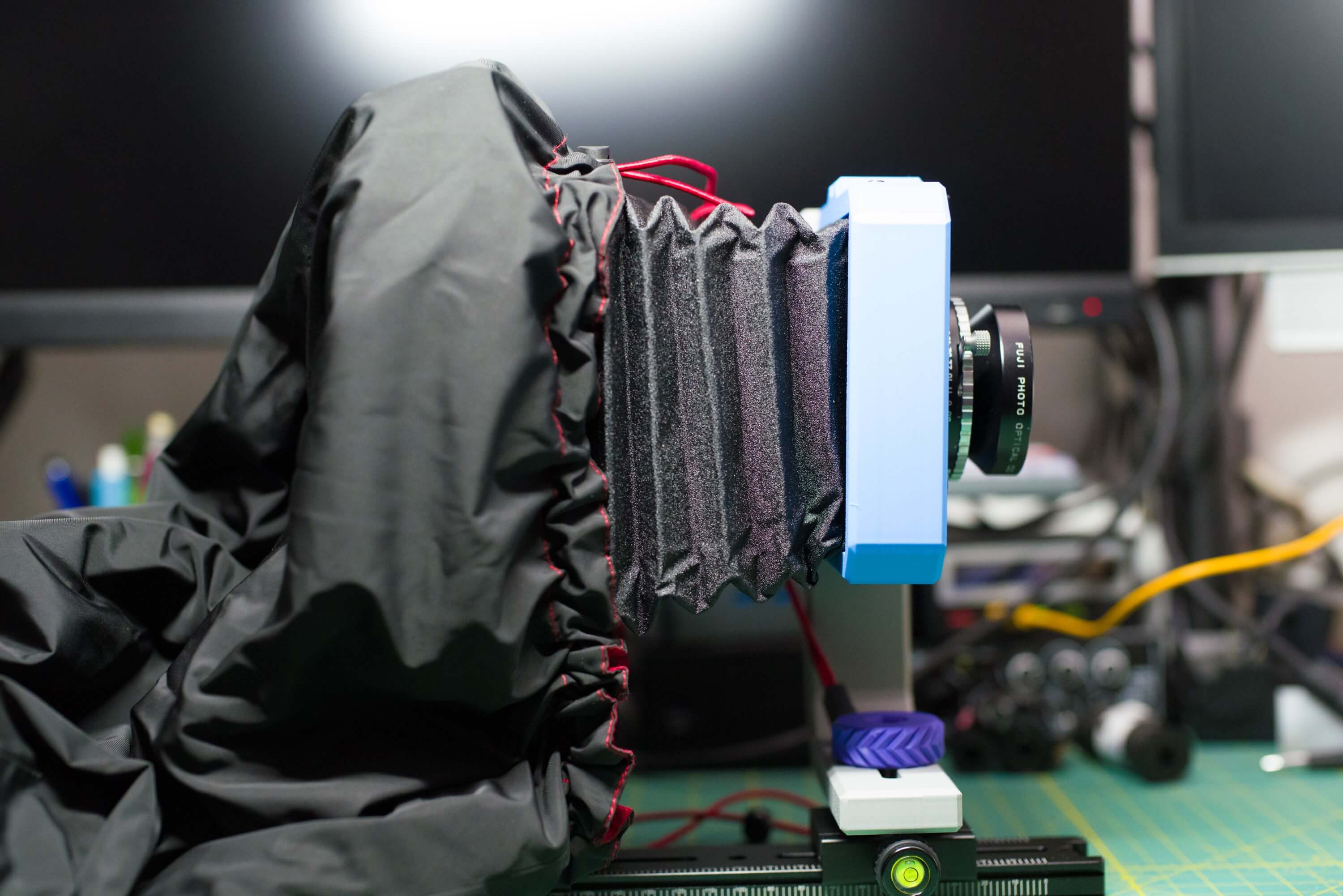 Focusing hood draped over the rear standard of the Vega 4x5