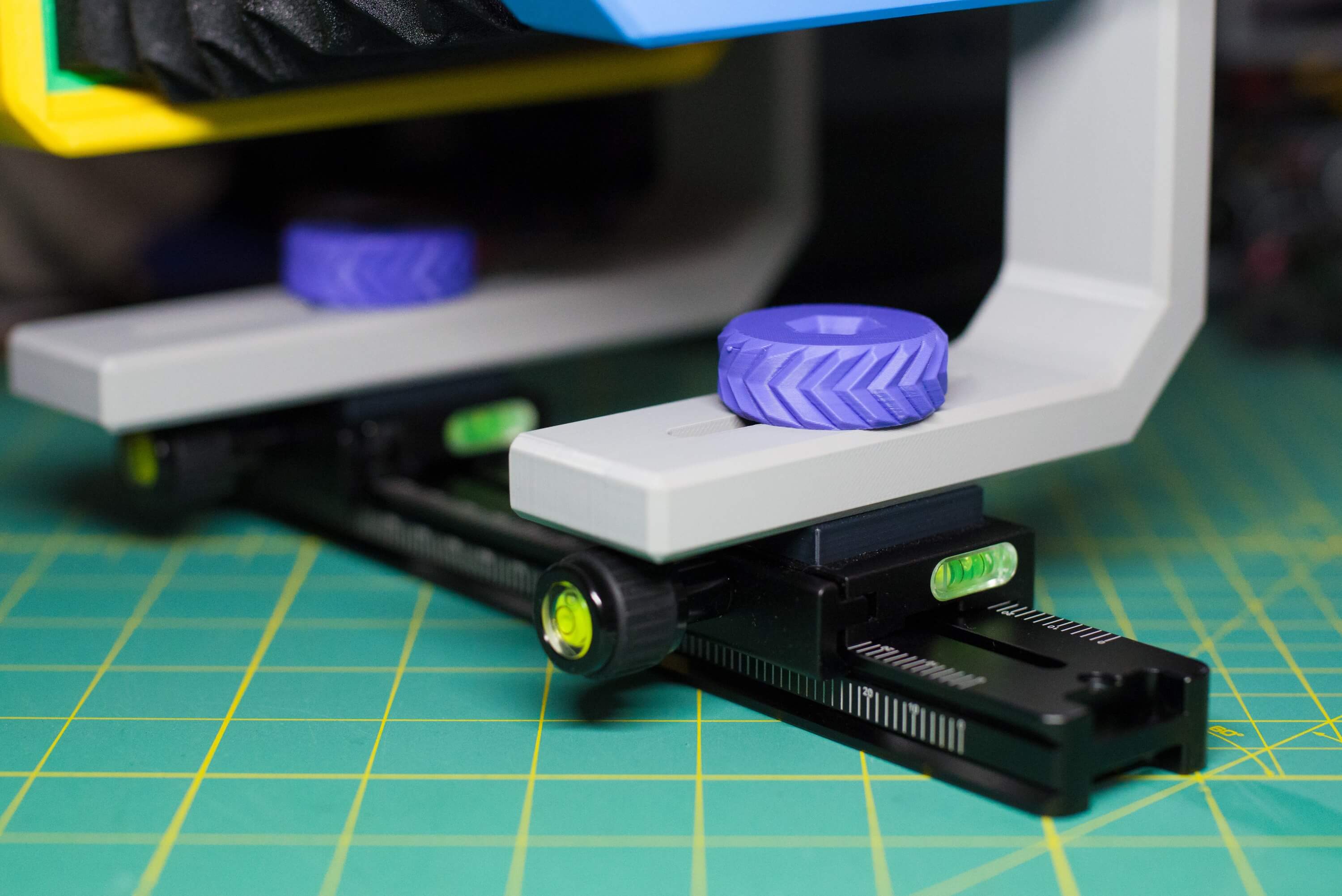 The front and rear forks of the camera have 1/4-20 bolts attaching them to arca clamps via spacers. Those clamps are tightened onto the double-sided arca rail.
